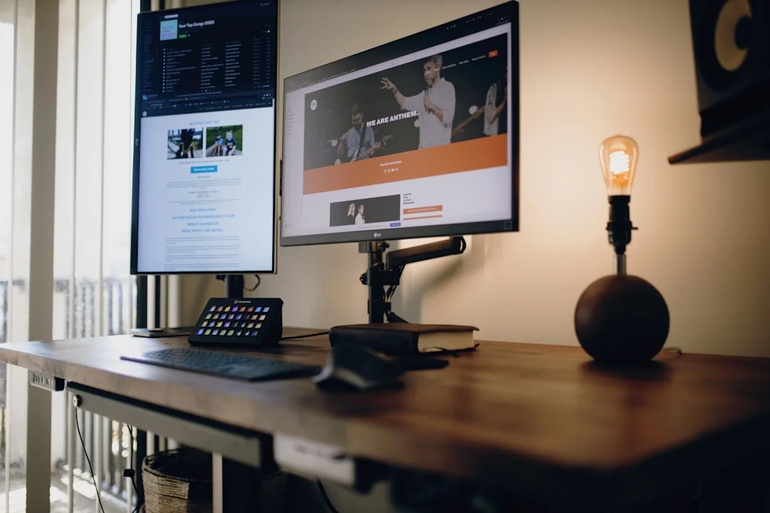 A modern computer screen displaying web design work, showcasing creative visuals in a workspace.